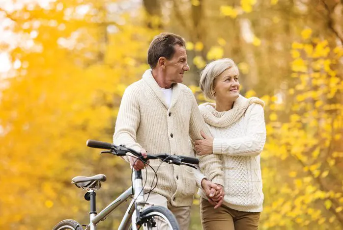 A man and woman standing next to each other.